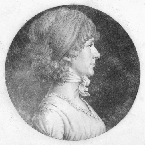 Figure 3. Head and shoulders profile of a woman wearing a neck scarf and embroidered dress.