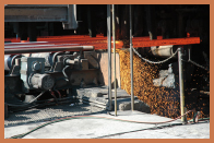 Manufactured steel rebar with a shower of sparks.