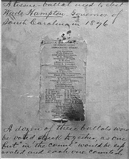 A ballot attached to paper with cursive handwriting surrounding it. The ballot has typed-text and a darkened right edge.
