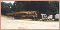 A logging truck loaded with lumber.