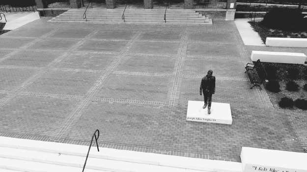 Figure 10. Bricks arranged in large and open checkered pattern with human statue in corner of plaza.